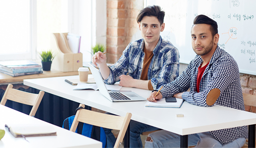 Infoglen Careers: Employees in a bright workspace accessing continuous learning and certification training.